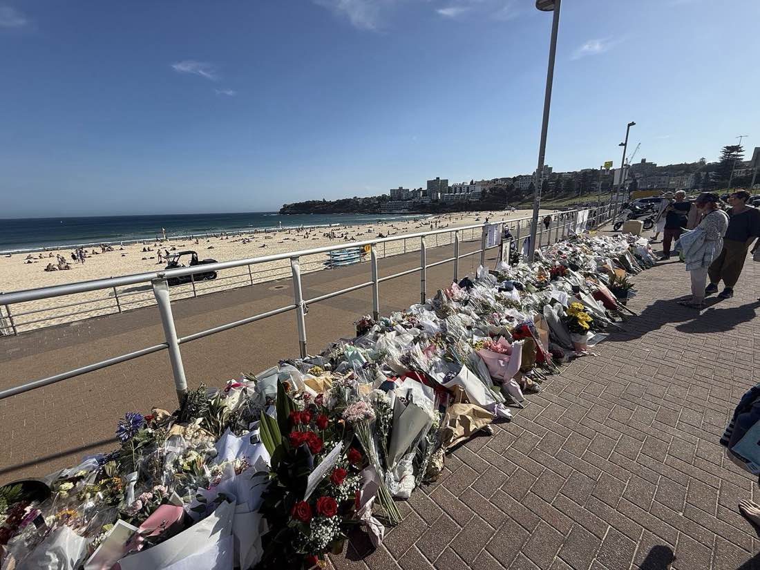Flowers left along the promenade at Bondi Beach, 18 December 2025.
